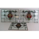 A set of three Edwardian stained glass panels of Art Nouveau design, 2 x 48cm x 34cm, 1 x 39cm x