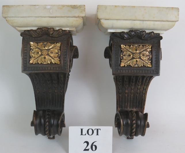 A pair of antique heavy bronze and marble wall corbels, each with an Ormulu acanthus centre and of