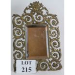 An antique French brass Art Nouveau mirror in easel frame with period bevelled glass plate.
