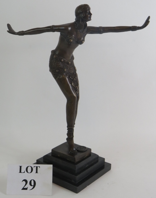 A 20th Century Art Deco style bronze of a dancer in the manner of Chiparus mounted on a three step