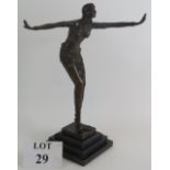 A 20th Century Art Deco style bronze of a dancer in the manner of Chiparus mounted on a three step