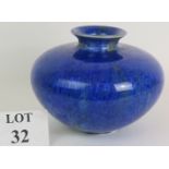 A large squat blue studio pottery vase by Tony Lamerick with overall seed head decoration. Marked