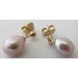 A pair of 9ct yellow gold suspended peach/grey pearl drop earrings. Condition report: Good