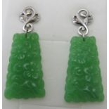 Carved natural Burmese jade earrings, 40mm x 15mm, post back. Rhodium over sterling silver, approx