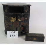 A Japanese lacquered hand decorated jewellery chest with six drawers and central cupboard plus a