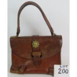 A handmade vintage leather bag with internal dividers and mounted with brass military badge. 27cm