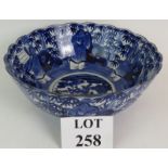 A large blue and white Japanese porcelain bowl probably early 20th Century decorated with scholars