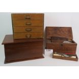 A hardwood fitted work box containing shoe and leather working accessories, a four drawer stationery