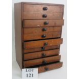 A flight of well made mahogany collector's drawers, each of the ten drawers with green baize