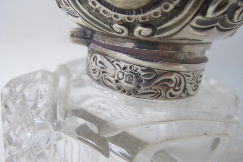 A pair of cut glass scent bottles with silver tops, London 1898, the silver tops embossed with - Image 2 of 5