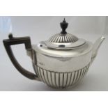 A silver teapot with half fluting decoration, London 1898, approx 20 troy oz/630 grams.