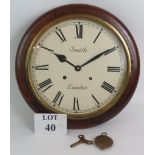 An early 20th Century Smith of London station style striking wall clock in oak case. Diameter