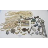 An assortment of mainly vintage jewellery to include a mourning brooch/pendant with locket and set