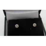 A pair of platinum six claw set round brilliant cut diamond solitaire stud earrings, diamonds 0.30ct