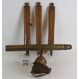 A 19th Century brass telescope and wooden tripod, the scope stamped W Ottway and Co Ealing 1885,