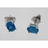 A pair of silver neon apatite stud earrings, approx 8mm x 6mm, approx weight 1.7 grams, stamped 925.