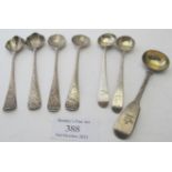 A set of four early Georgian silver salt spoons engraved with crests, hallmarks worn, a pair of
