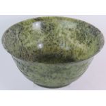 A large Chinese carved spinach Jade bowl, 27cm in diameter, 12cm tall. Very finely carved to a