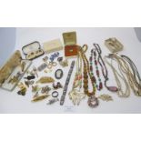 A large collection of mainly vintage costume jewellery and cuff links to include a pair of rolled