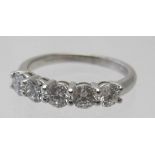 An 18ct white gold ring set with five round brilliant cut diamonds, 1.09cts, approx weight 3.2
