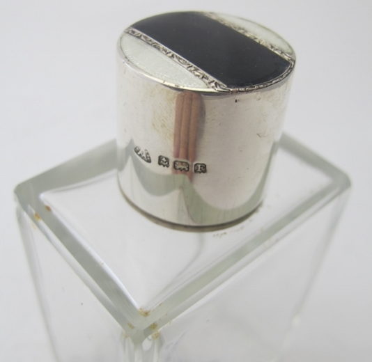 A rectangular glass scent bottle with black & white enamelling on the silver top, Birmingham 1930. - Image 2 of 2