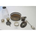 An assortment of mainly silver items to include a silver coaster with pierced sides, Silver