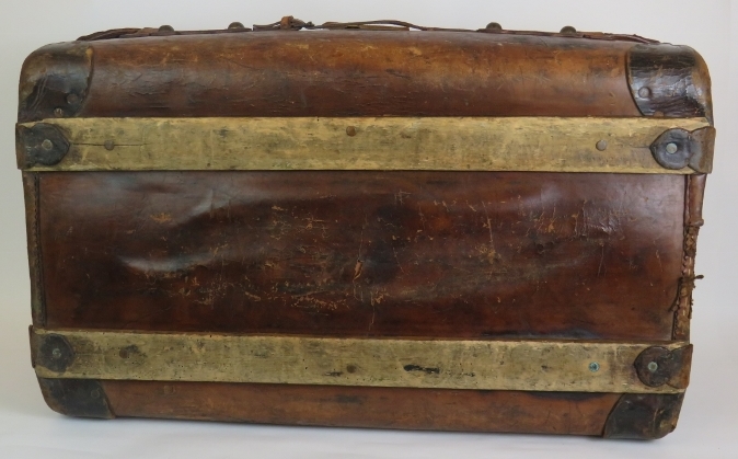 An antique leather travel trunk with wood slatted base and period labels. 82cm x 50cm x 30cm. - Image 4 of 4
