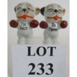 A pair of porcelain Bonzo The Dog novelty salt and pepper pots, hand painted and marked Made in