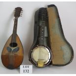 A vintage Wallio Stro Banjolele with case and a Mario Casella bowl backed mandolin. (2). Condition