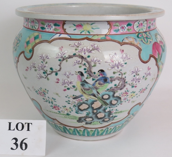 An antique Chinese porcelain Jardinière decorated in the Canton style on a light blue ground. Signed