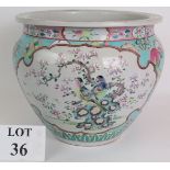 An antique Chinese porcelain Jardinière decorated in the Canton style on a light blue ground. Signed