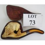 An antique carved Meerschaum pipe in the form of a Turk's head with nude female in his beard.