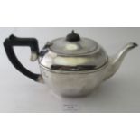 A silver teapot with panelled sides, Birmingham 1922, approx weight 15.6 troy oz/488 grams.