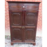 A smart antique Georgian style mahogany twin door wardrobe c 1900, having dentil moulded shaped