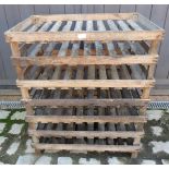 Seven vintage wooden stacking fruit trays.