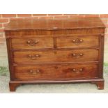 A Georgian mahogany straight front chest of two short over two long graduated cock beaded drawers