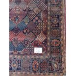 An early 20th Century possibly Bakhtiari rug with a very intricate weave. 225cm x 135cm. Condition