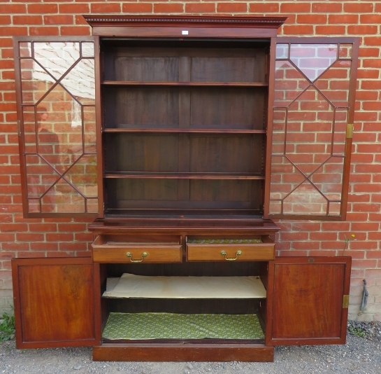 An Edwardian mahogany tall bookcase with dentil cornice over astral glazed doors opening onto - Image 4 of 4