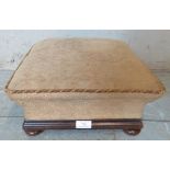 A Victorian oak framed square footstool on bun feet. 18cm high x 34cm wide x 34cm deep (approx).