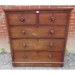 A Victorian mahogany chest of drawers, two short over three long cock bead drawers with turned