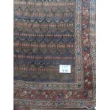 A mid 20th Century Persian wool rug. 111cm x 267cm. Condition report: Worn in places. Please see