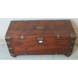 A 19th century oak brass bound campaign chest with internal candle holder box, raised on bun feet.