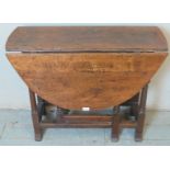 An 18th century oak oval gateleg table with single drawer. 70cm high x 108cm wide x 90cm deep (