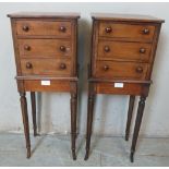 A pair of Victorian mahogany bedside cabinets of small proportions, each containing three short