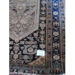 A mid 20th Century Persian wool rug, with central Medallion. 138cm x 197cm. Condition report: Even