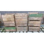 Nine vintage wooden fruit boxes.