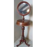 A Victorian mahogany gentleman's shaving stand with height adjustable mirror over two hinged