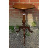 An Edwardian Regency revival mahogany circular wine table with a dished top over a fluted column
