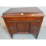 A 1920's oak cased freestanding gramophone by Gilbert with applied moulded decoration to case and