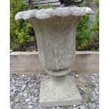 A reconstituted stone planter in the Grecian style mounted on a plinth. 53m high x 40cm wide x